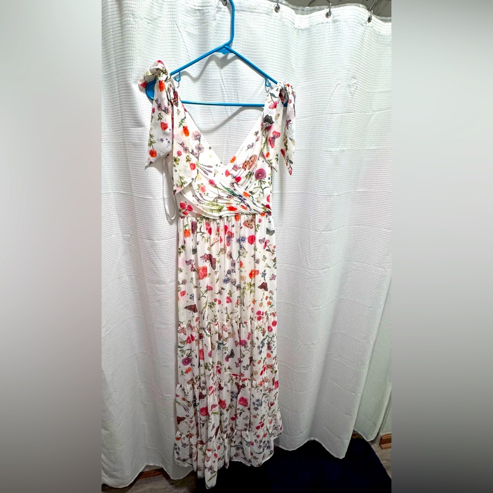 MacDuggal formal gown. Faux ties at the shoulder. Zipper closure.